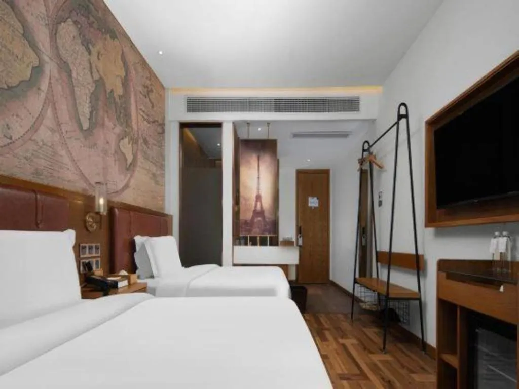 Bed in James Joyce Coffetel Luoyang Longmen High-speed Railway Station Baolong Plaza