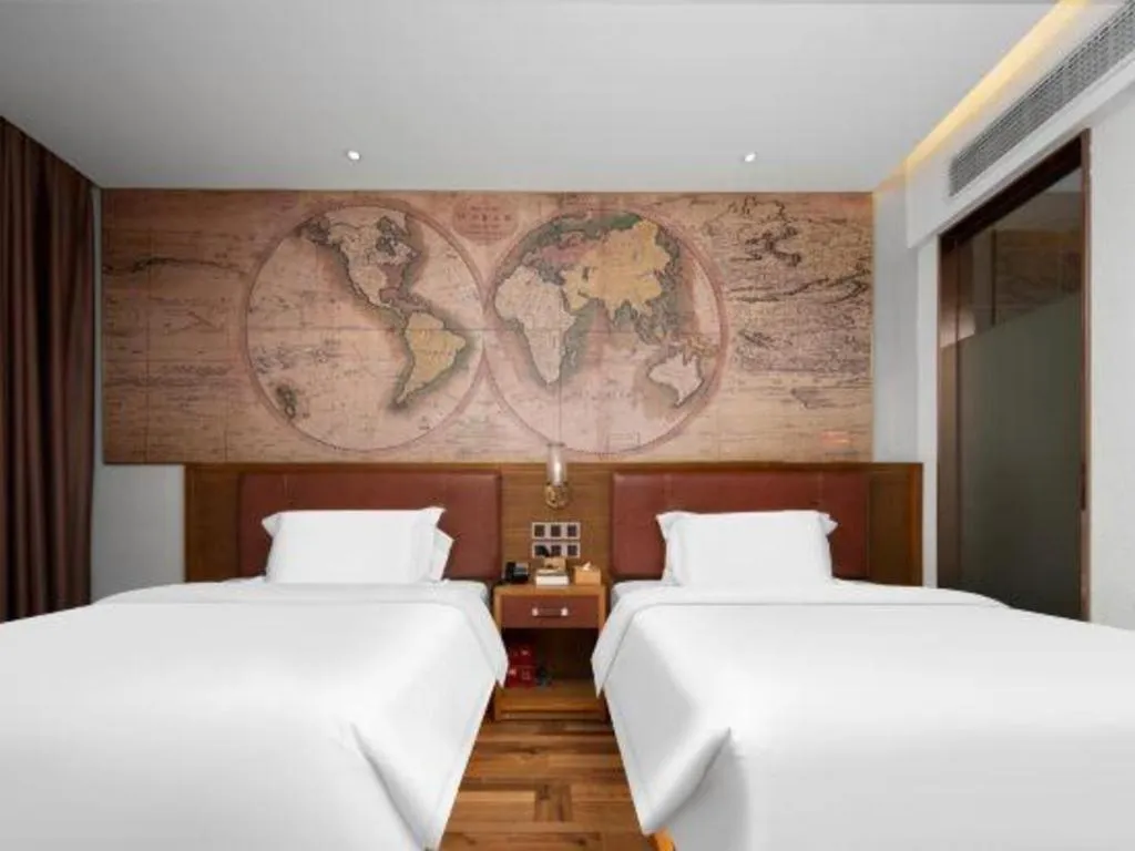 Bed in James Joyce Coffetel Luoyang Longmen High-speed Railway Station Baolong Plaza