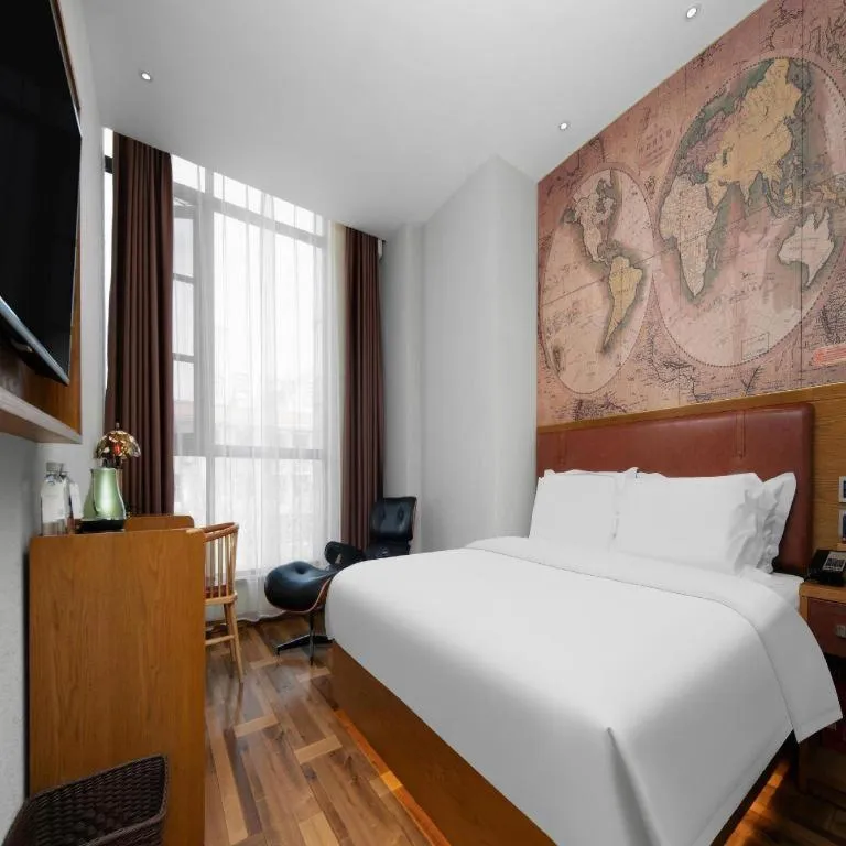 Bed in James Joyce Coffetel Luoyang Longmen High-speed Railway Station Baolong Plaza