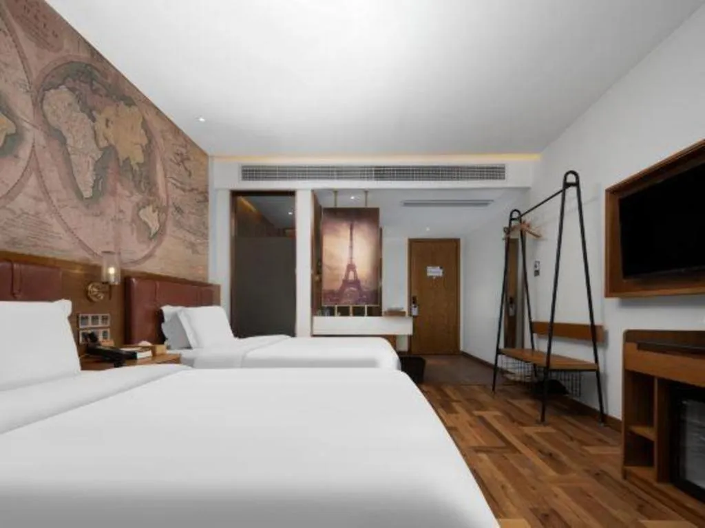 Bed in James Joyce Coffetel Luoyang Longmen High-speed Railway Station Baolong Plaza