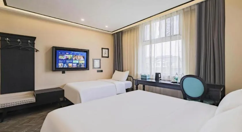 Bed in Xana Lite Hotelle Tianjin Huaming Binhai International Airport