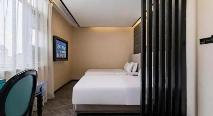 Bed in Xana Lite Hotelle Tianjin Huaming Binhai International Airport