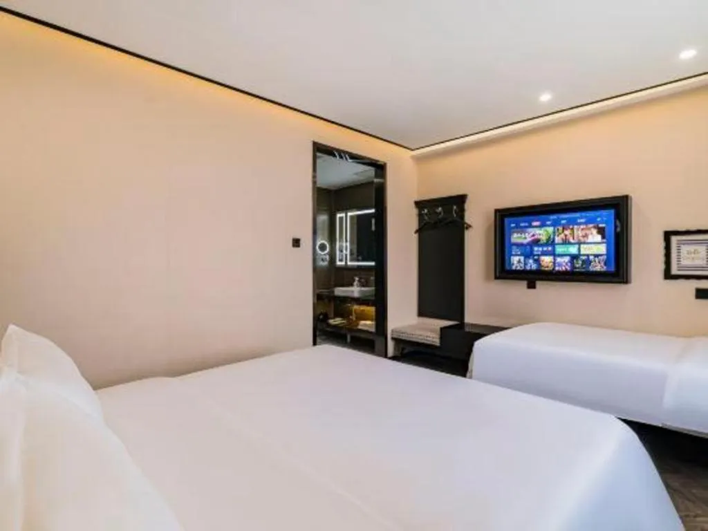 Bed in Xana Lite Hotelle Tianjin Huaming Binhai International Airport