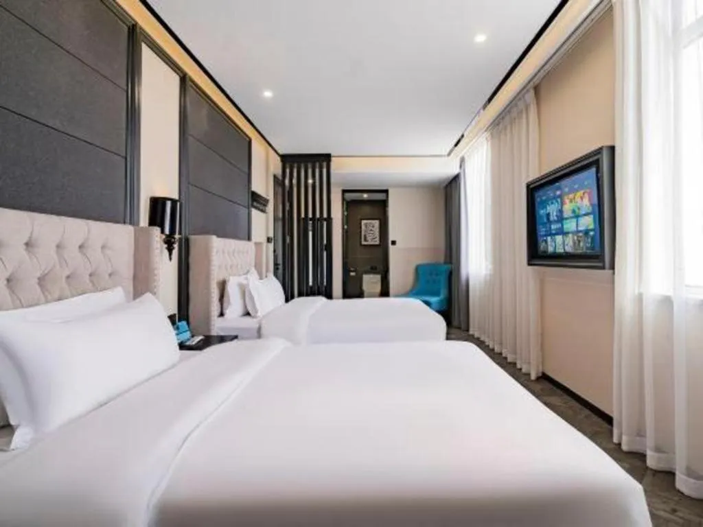 Bed in Xana Lite Hotelle Tianjin Huaming Binhai International Airport