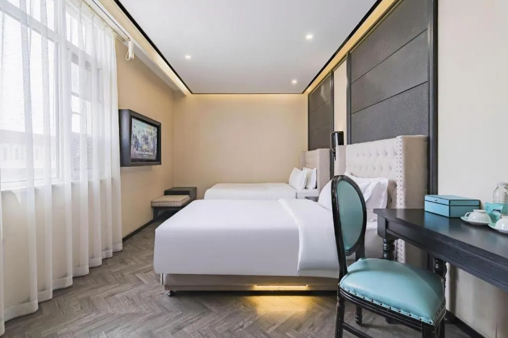 Bed in Xana Lite Hotelle Tianjin Huaming Binhai International Airport