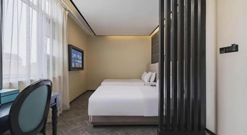 Bed in Xana Lite Hotelle Tianjin Huaming Binhai International Airport