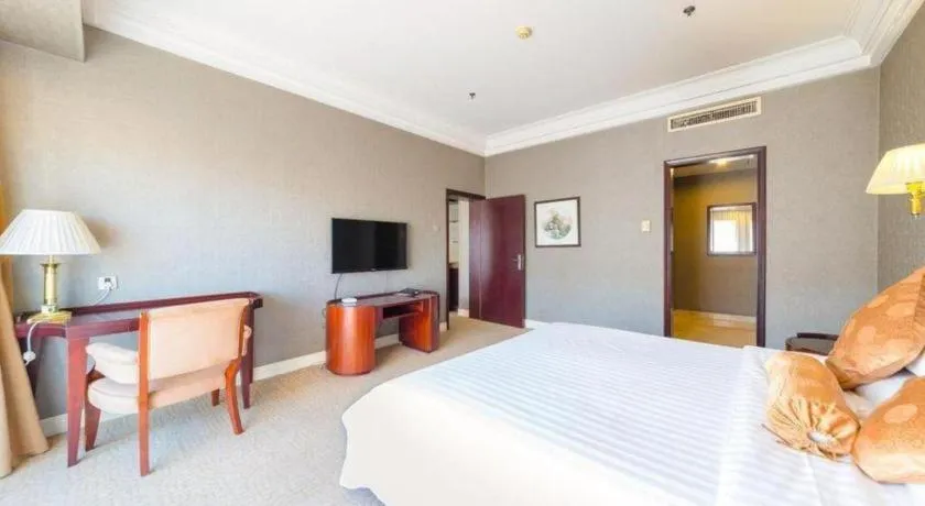 Bed in Jinjiang Hotel Qianan