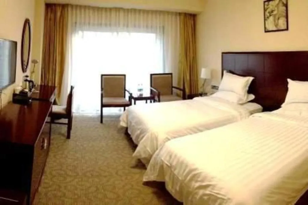 Bed in Jinjiang Hotel Qianan