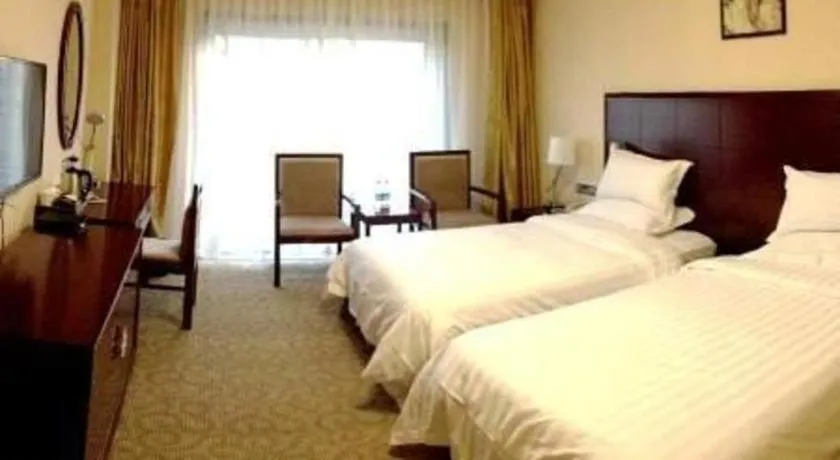 Bed in Jinjiang Hotel Qianan