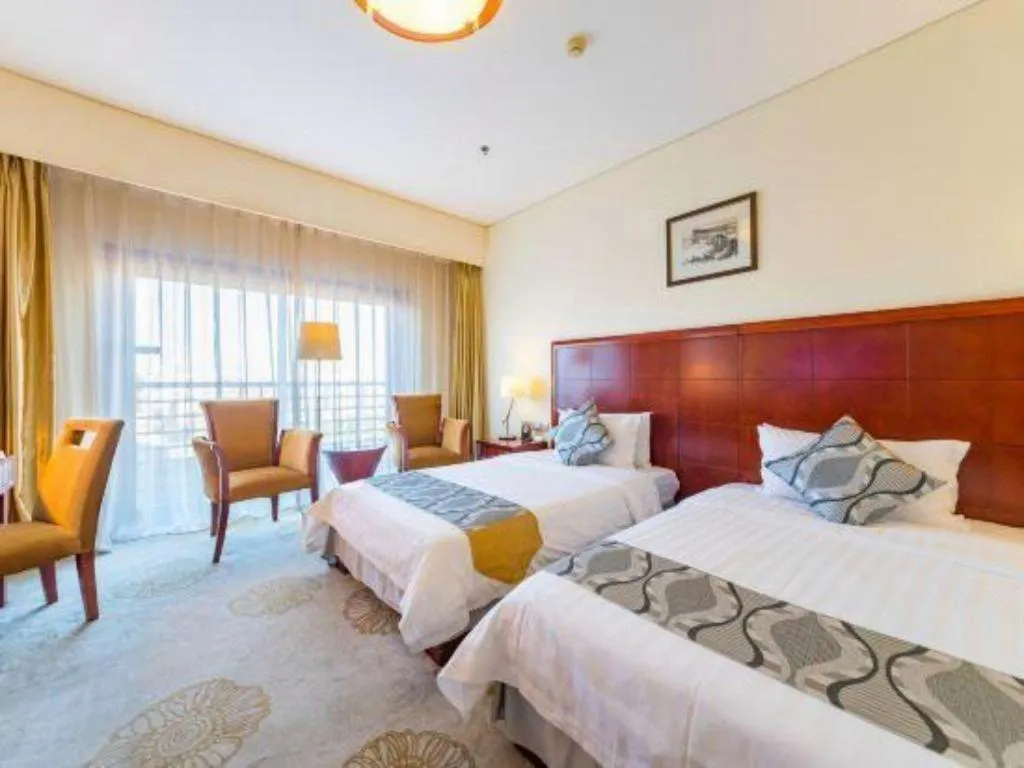 Bed in Jinjiang Hotel Qianan