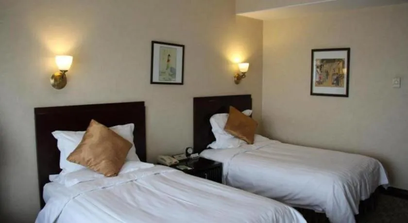 Bed in Jinjiang Hotel Qianan