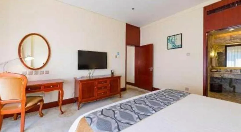 Bed in Jinjiang Hotel Qianan