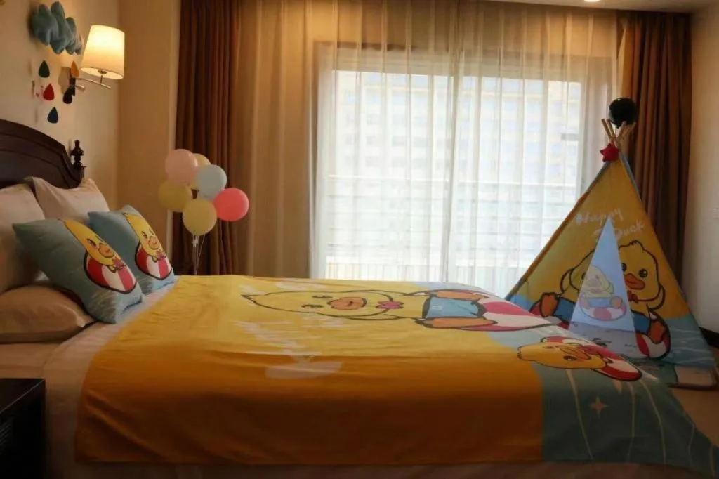 Bed in Jinjiang Hotel Qianan