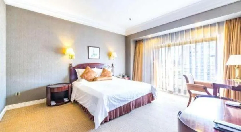 Bed in Jinjiang Hotel Qianan