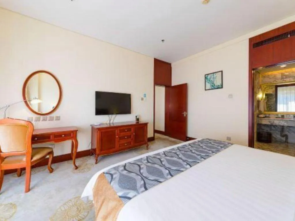 Bed in Jinjiang Hotel Qianan