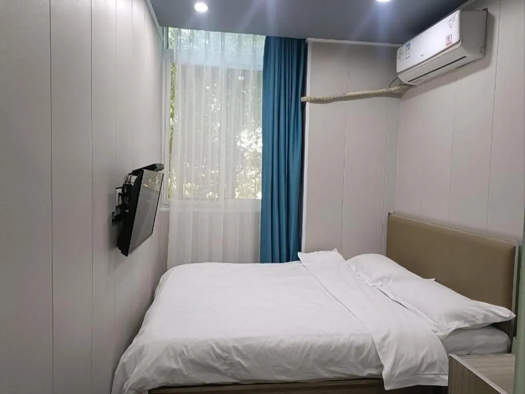 Bed in Shell Hotel Taixing Huangqiao Town Dinghui Road