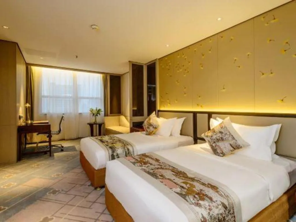 Bed in Dahe Jinjiang Hotel