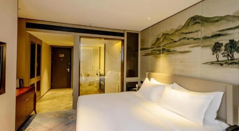 Bed in Dahe Jinjiang Hotel