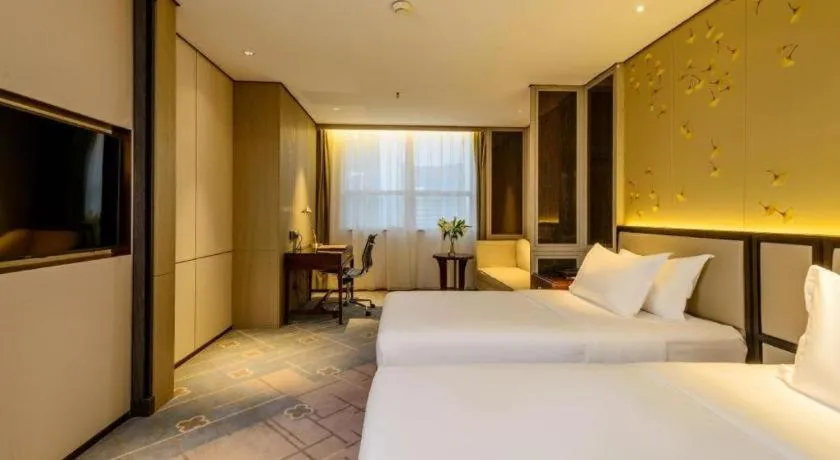 Bed in Dahe Jinjiang Hotel