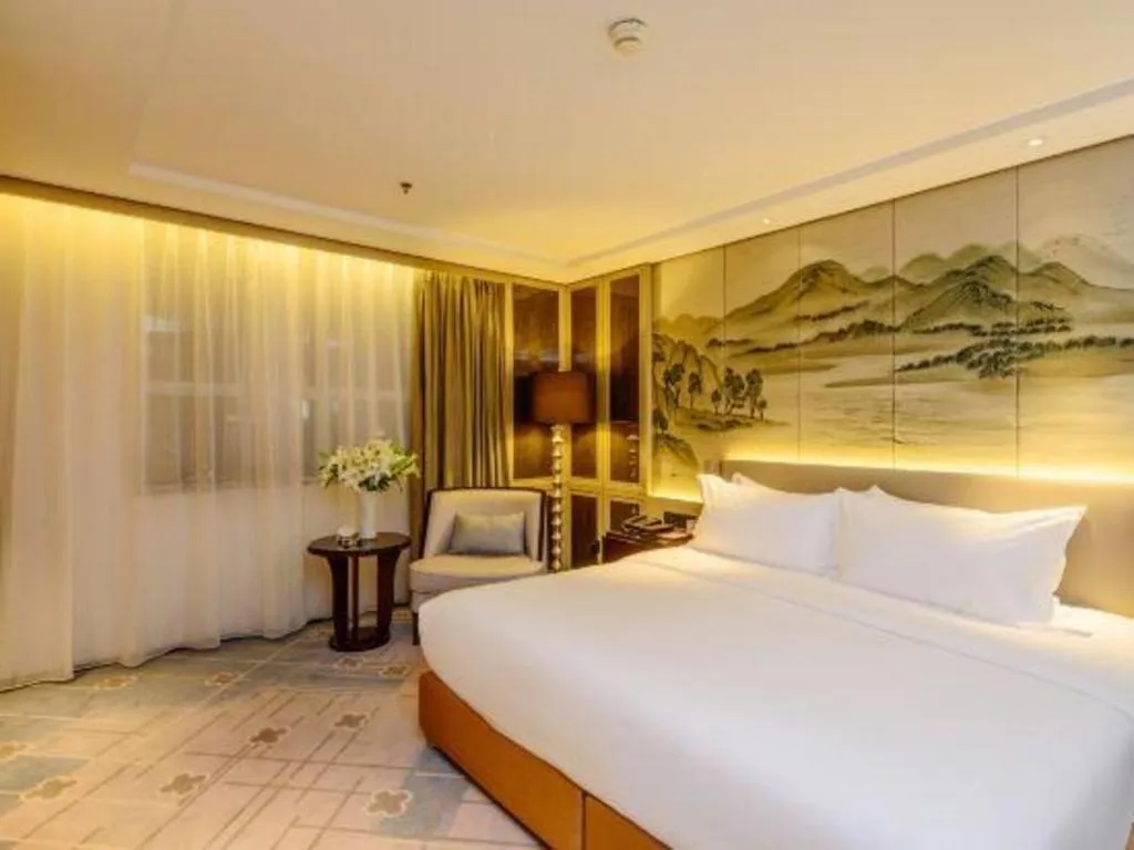 Bed in Dahe Jinjiang Hotel