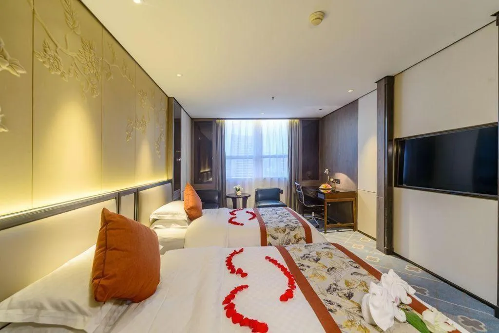 Bed in Dahe Jinjiang Hotel