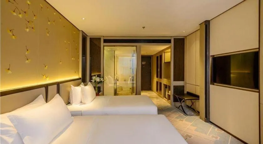 Bed in Dahe Jinjiang Hotel