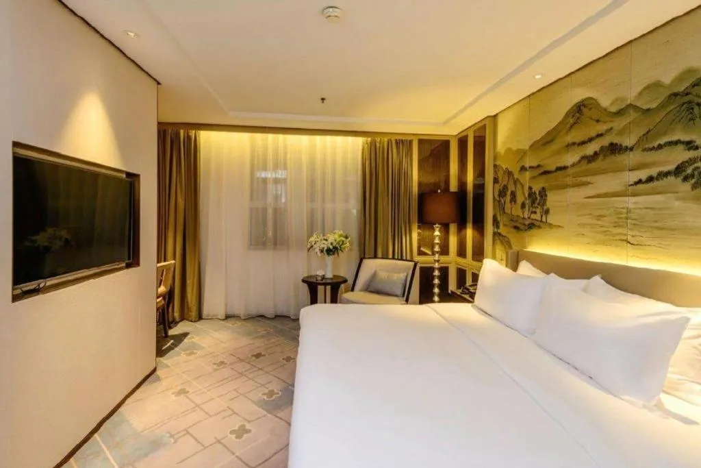 Bed in Dahe Jinjiang Hotel