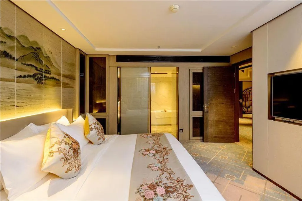 Bed in Dahe Jinjiang Hotel