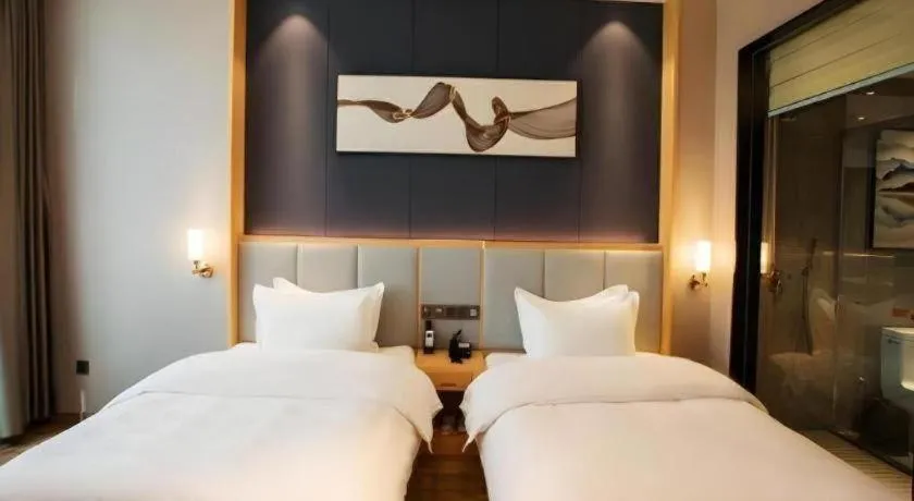 Bed in GreenTree Eastern Hotel Yunnan Shangri-La Yangtang Road