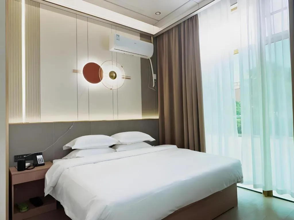 Bed in Shell Hotel Nanyang High-Speed Railway Station Jiangying Airport Huayaocheng