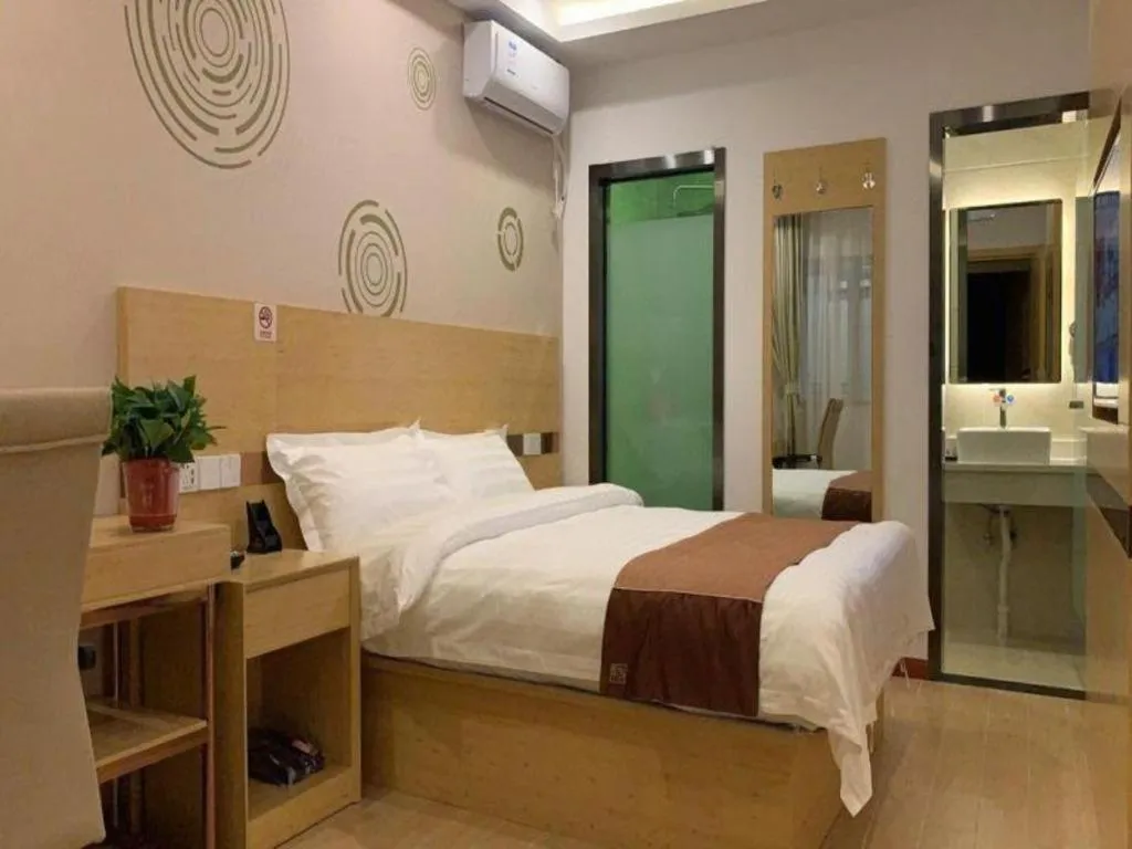 Bed in Shell Hotel Beijing Fangshan District Chengguan Metro Station