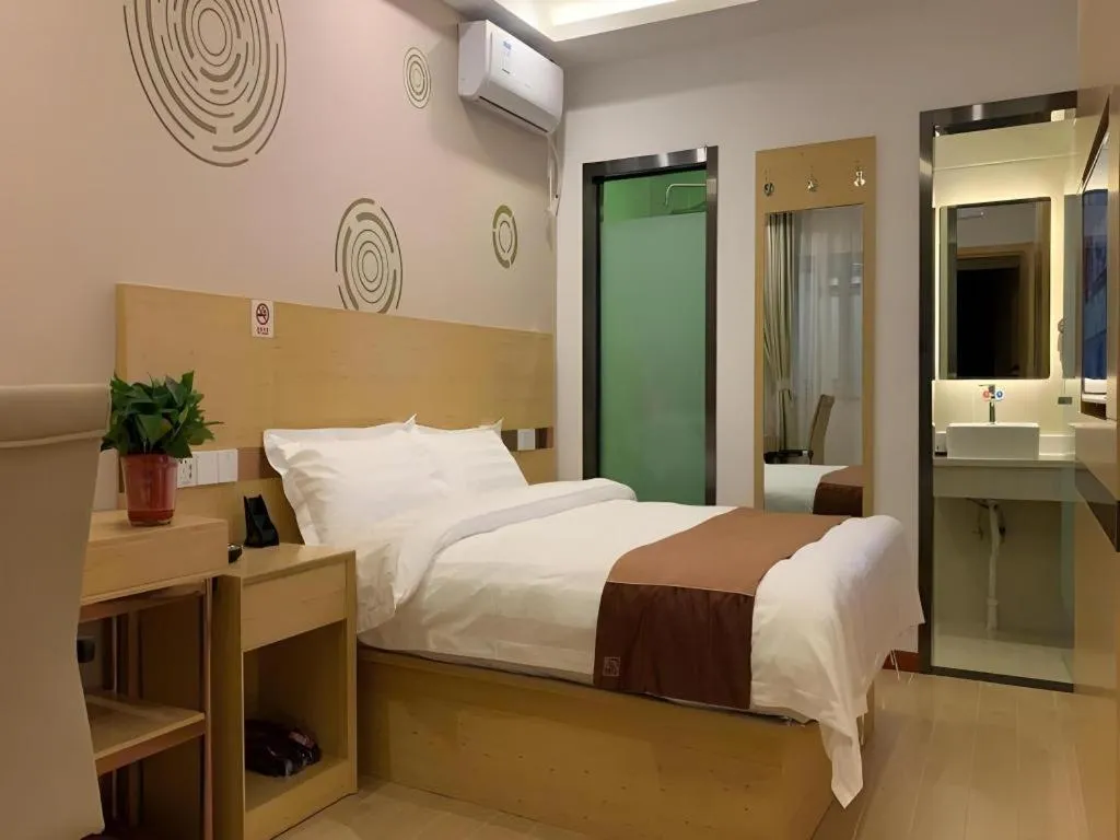 Bed in Shell Hotel Beijing Fangshan District Chengguan Metro Station