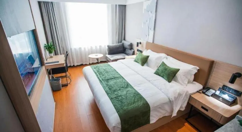 Bed in GreenTree Inn Tangshan Nanhu International Exhibition Center