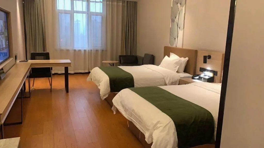 Bed in GreenTree Inn Tangshan Nanhu International Exhibition Center