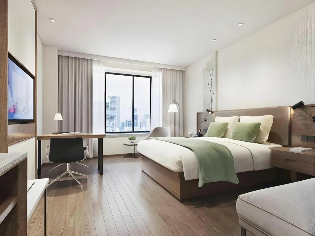 Bed in GreenTree Inn Tangshan Nanhu International Exhibition Center