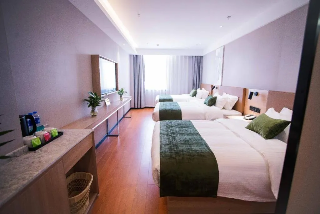 Bed in GreenTree Inn Tangshan Nanhu International Exhibition Center