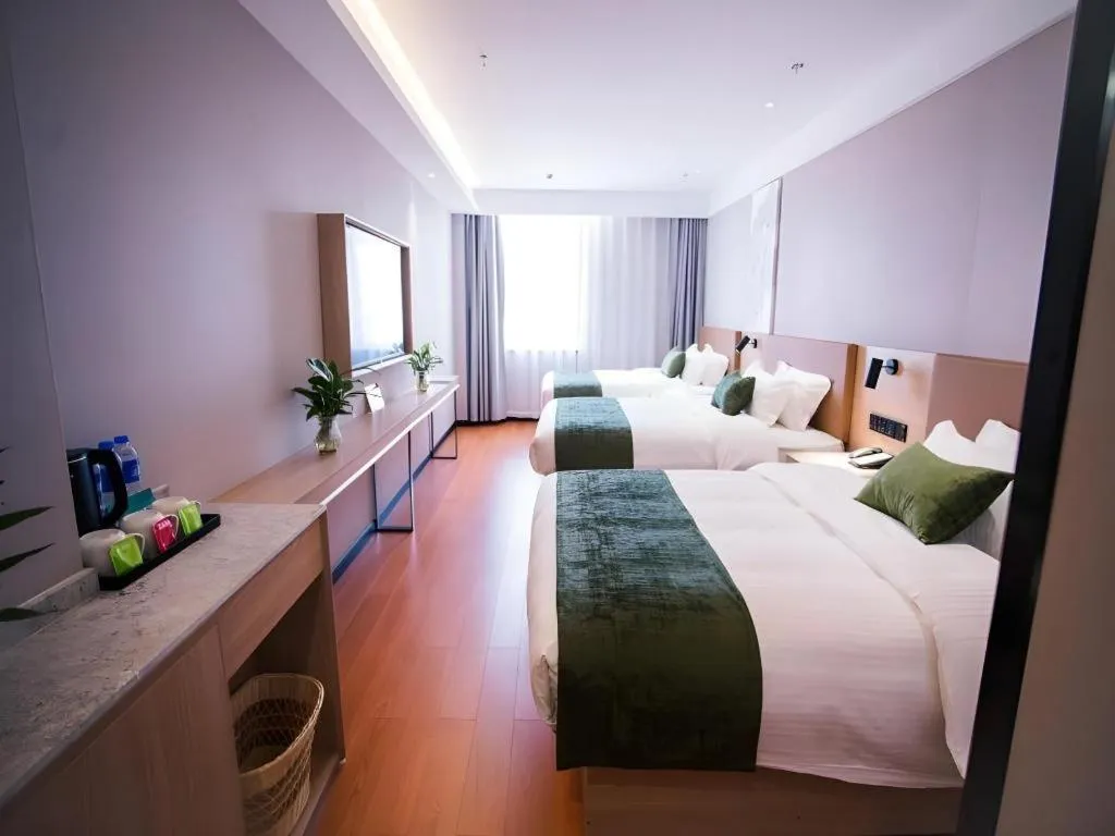 Bed in GreenTree Inn Tangshan Nanhu International Exhibition Center