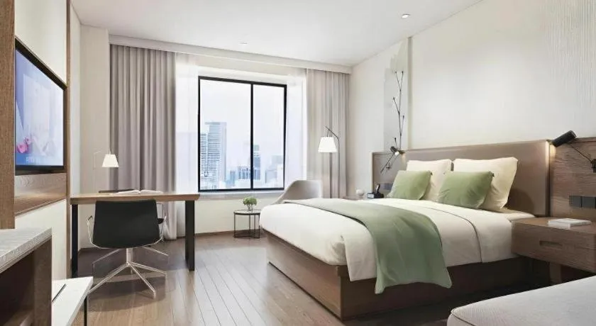 Bed in GreenTree Inn Tangshan Nanhu International Exhibition Center