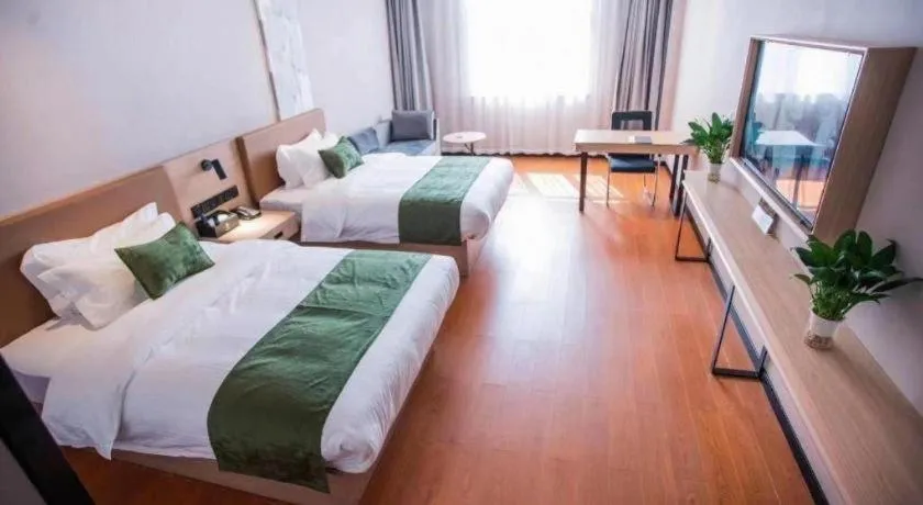 Bed in GreenTree Inn Tangshan Nanhu International Exhibition Center