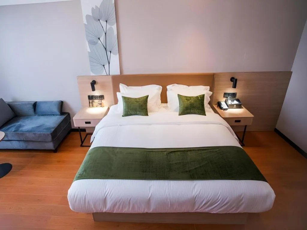 Bed in GreenTree Inn Tangshan Nanhu International Exhibition Center