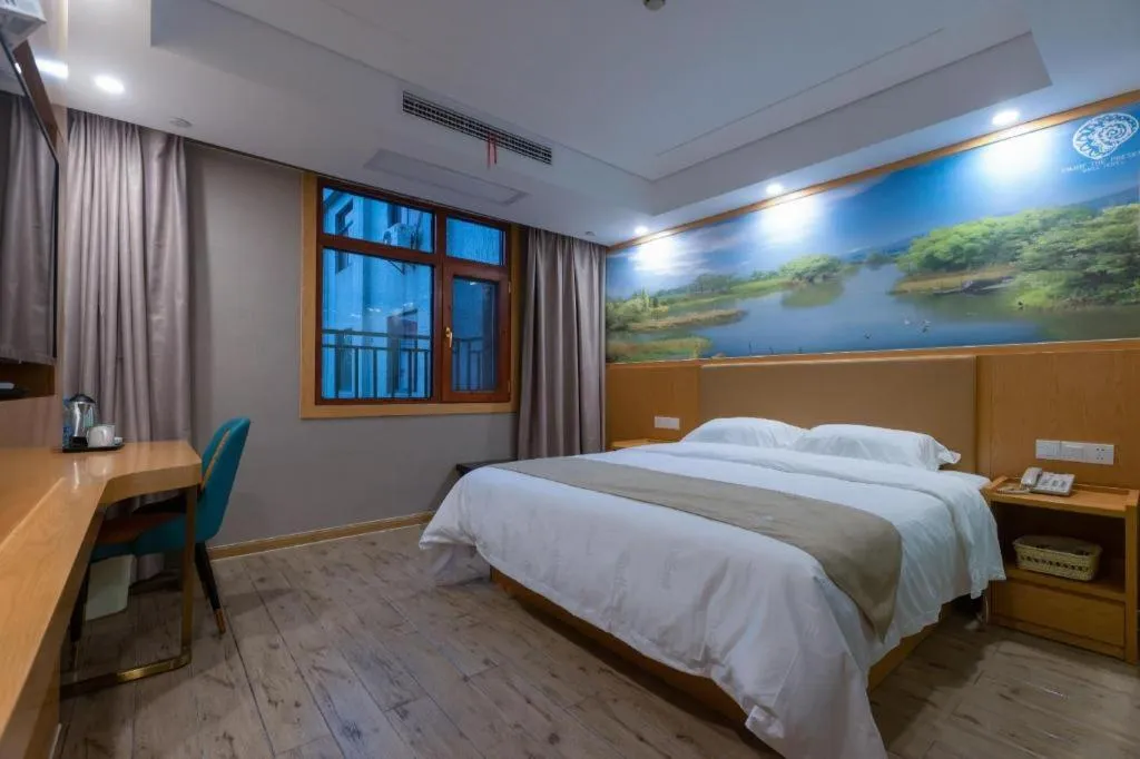 Bed in Shell Hotel Changzhou North Railway Station Global Harbor Metro Station