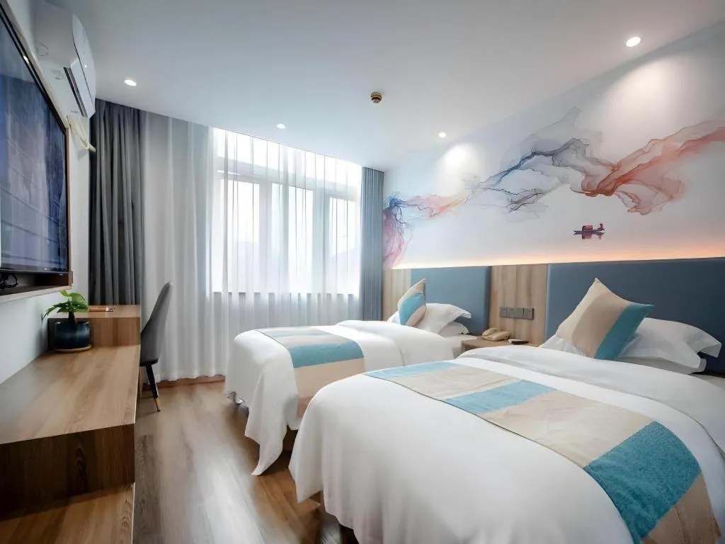 Bed in VX Hotel Hangzhou Banshan