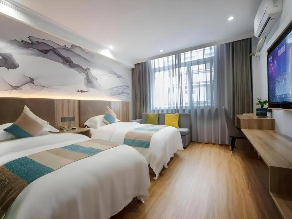 Bed in VX Hotel Hangzhou Banshan