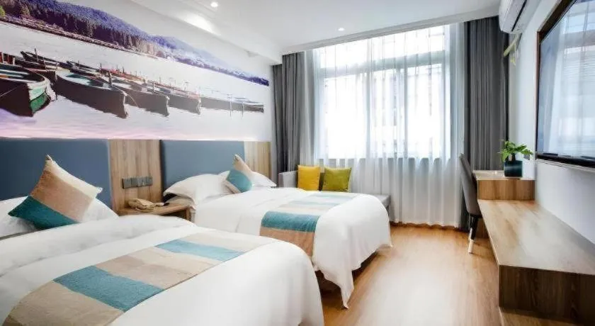 Bed in VX Hotel Hangzhou Banshan