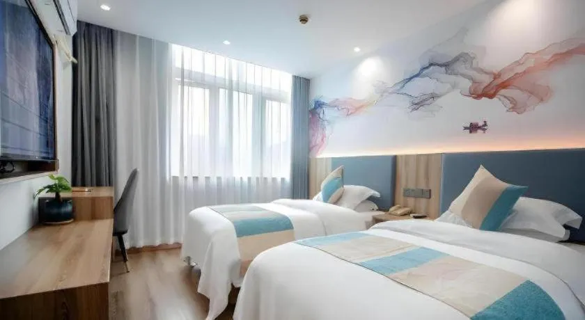 Bed in VX Hotel Hangzhou Banshan