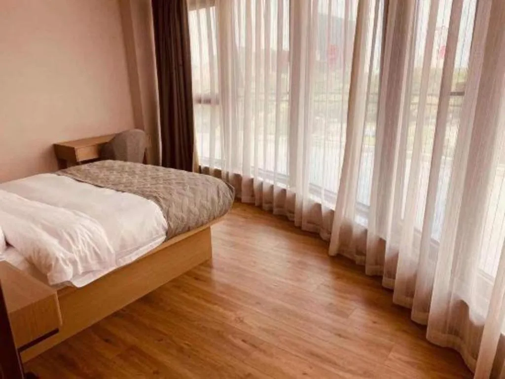 Bed in Gya Hotel Nantong Nanshang Lake Street Wanda Plaza