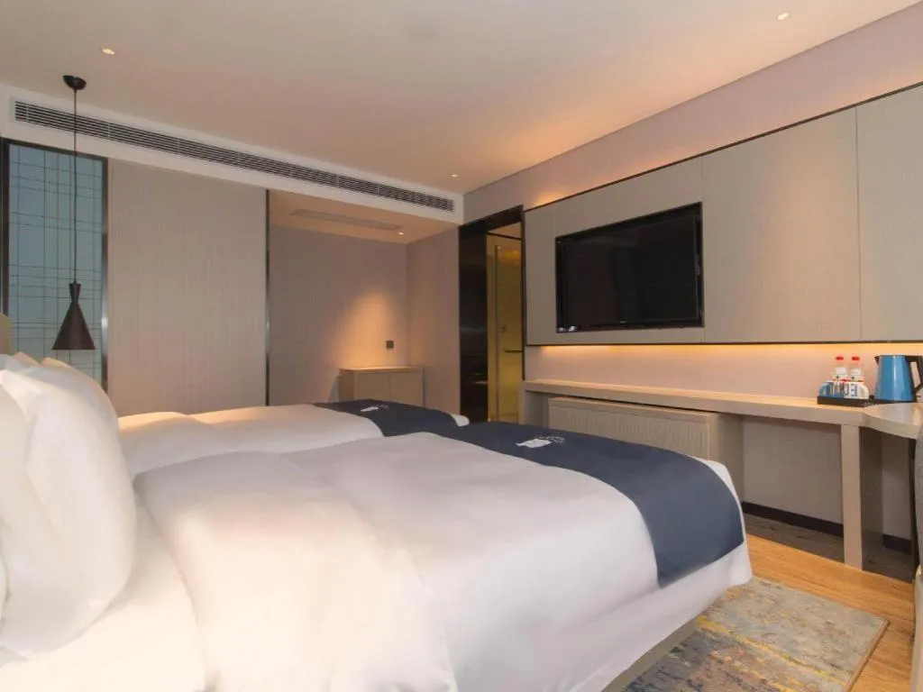 Bed in Echarm Hotel Changsha Wuyi Square Railway Metro Station