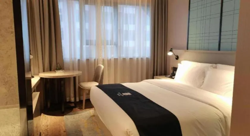 Bed in Echarm Hotel Changsha Wuyi Square Railway Metro Station