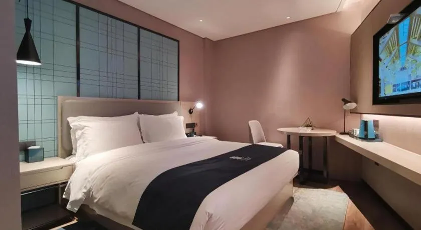 Bed in Echarm Hotel Changsha Wuyi Square Railway Metro Station
