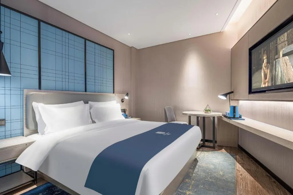 Bed in Echarm Hotel Changsha Wuyi Square Railway Metro Station